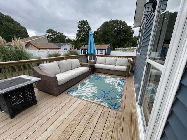 wooden deck with outdoor lounge area