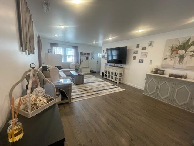 living room featuring dark hardwood / wood-style floors