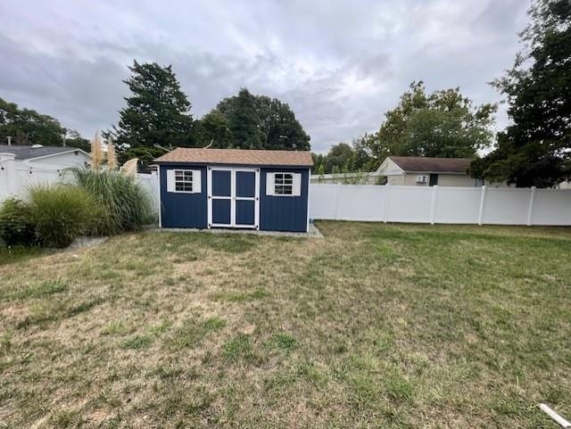 view of outbuilding with a lawn