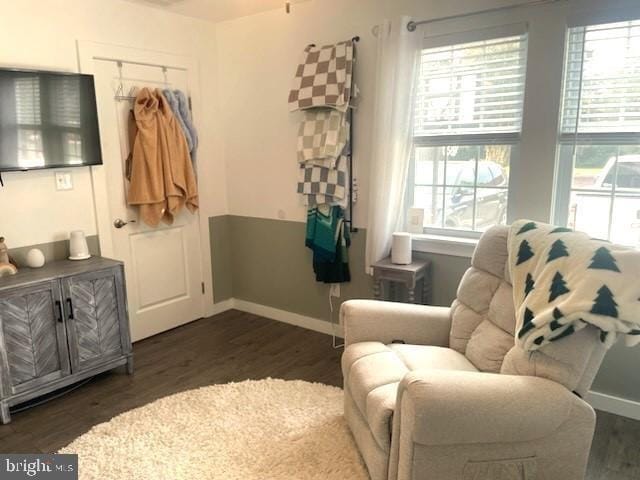 sitting room with dark hardwood / wood-style flooring