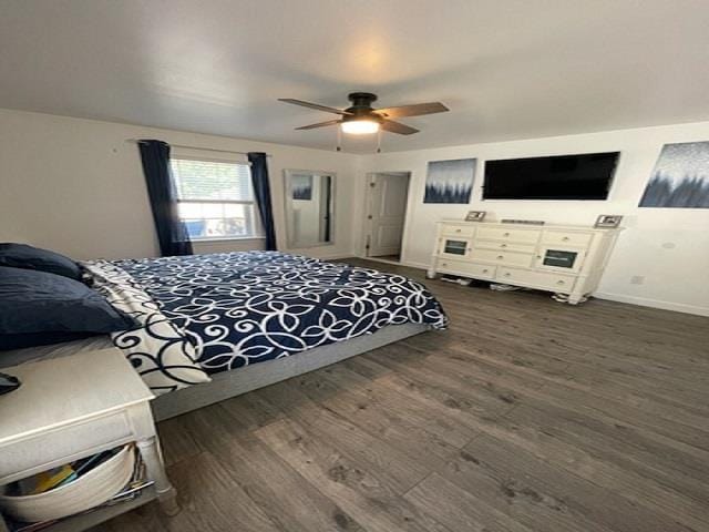 bedroom with ceiling fan and dark wood-type flooring