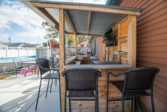 view of patio featuring a bar