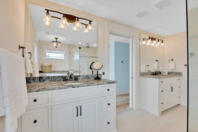243 N Point Rd, Ocean City, NJ 08226 - bathroom with tile patterned flooring, vanity, and a shower with shower door