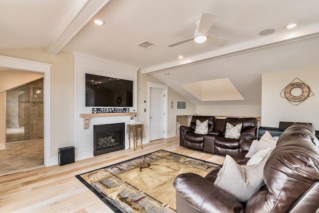 243 N Point Rd, Ocean City, NJ 08226 - living room featuring lofted ceiling with beams, a large fireplace, ceiling fan, and light wood-type flooring