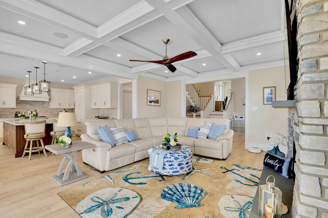 243 N Point Rd, Ocean City, NJ 08226 - living room with coffered ceiling, crown molding, light wood-type flooring, beam ceiling, and ceiling fan with notable chandelier
