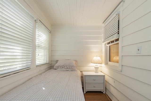 bedroom featuring wooden ceiling and dark wood-type flooring