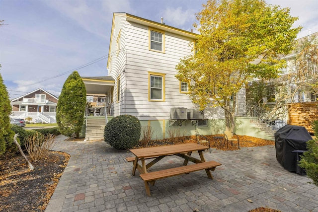 back of property featuring a patio area