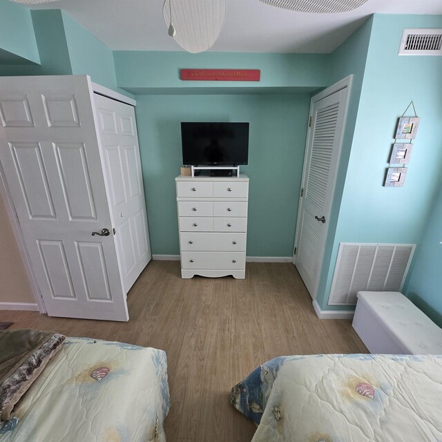 1800 Ocean Ave Unit 515, North Wildwood, NJ 08260 - bedroom with wood finished floors, baseboards, and a closet