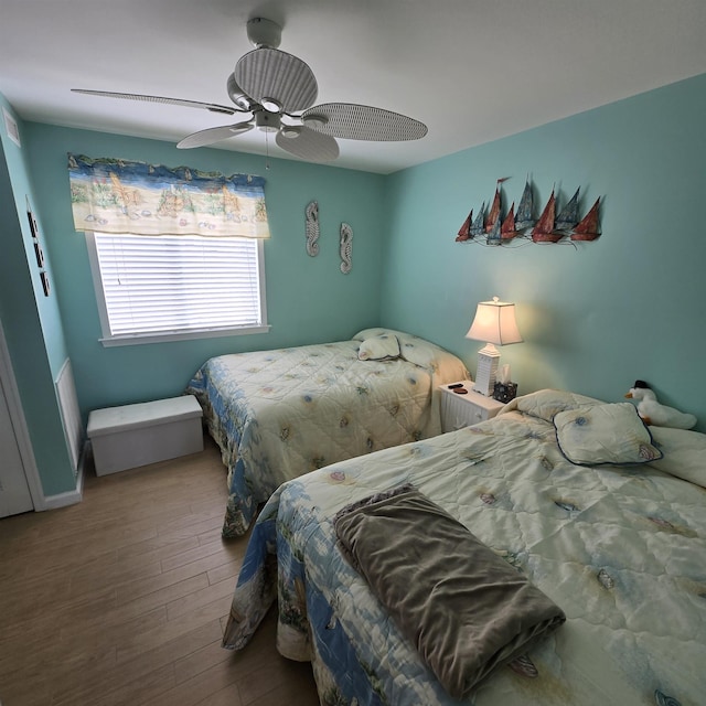 1800 Ocean Ave Unit 515, North Wildwood, NJ 08260 - bedroom with wood finished floors, a ceiling fan, and baseboards