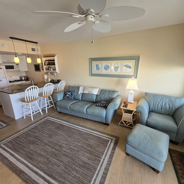 1800 Ocean Ave Unit 515, North Wildwood, NJ 08260 - living area with wood finished floors and ceiling fan
