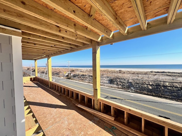 view of patio / terrace featuring a water view and a view of the beach