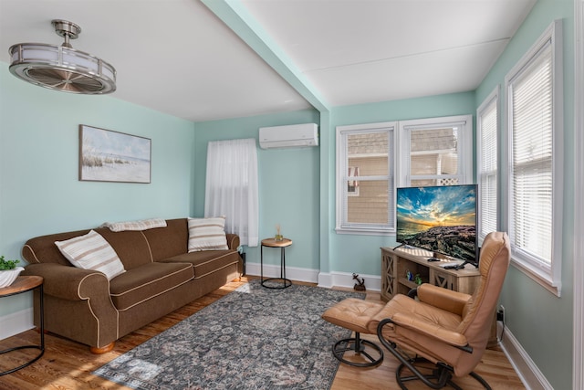 living room featuring a wall mounted AC and light wood-type flooring