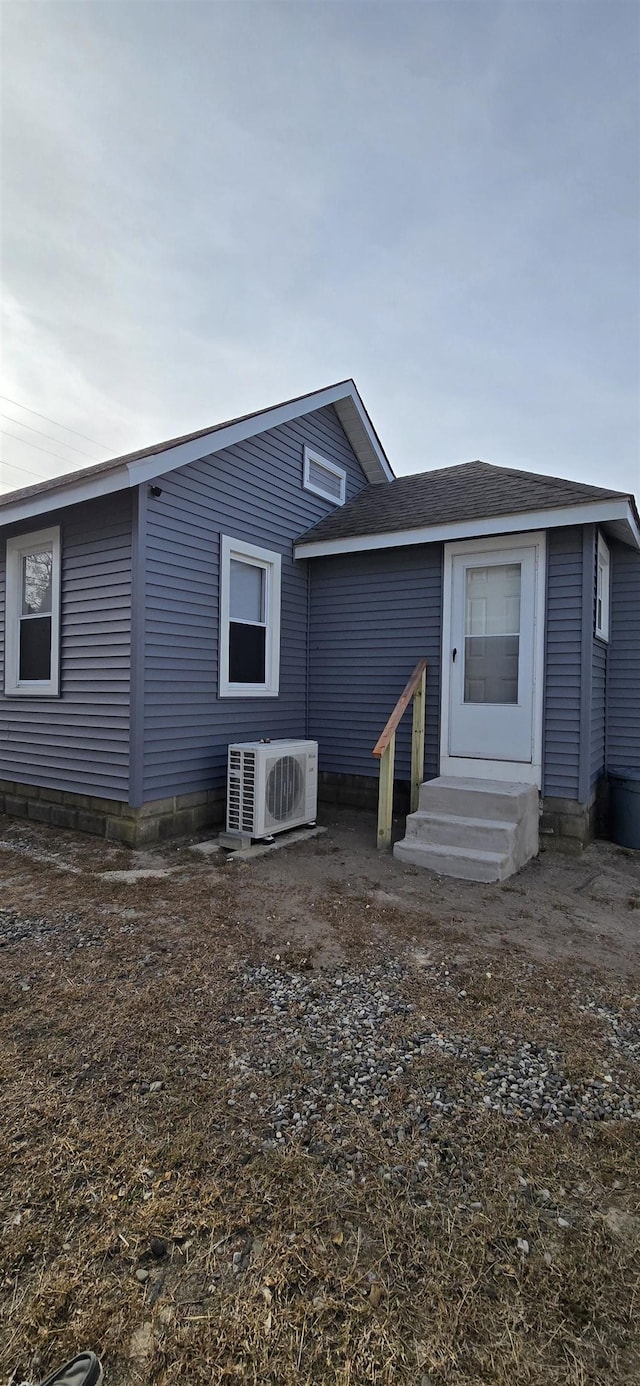 back of house featuring ac unit