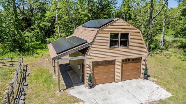 463 Rte 47 N, Goshen, NJ 08210 - view of front facade with a gambrel roof, solar panels, concrete driveway, and a garage