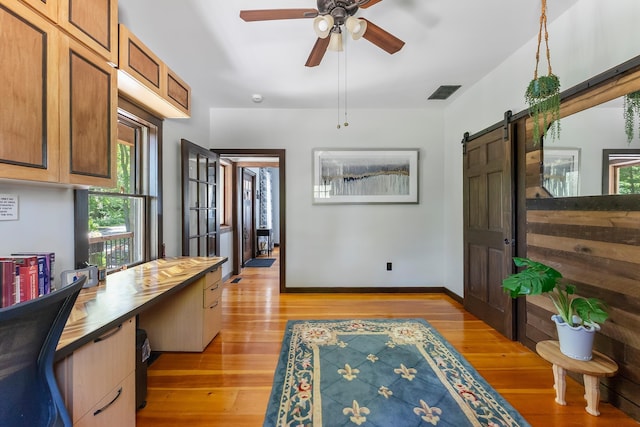 463 Rte 47 N, Goshen, NJ 08210 - entrance foyer featuring a barn door, light wood finished floors, ceiling fan, and baseboards