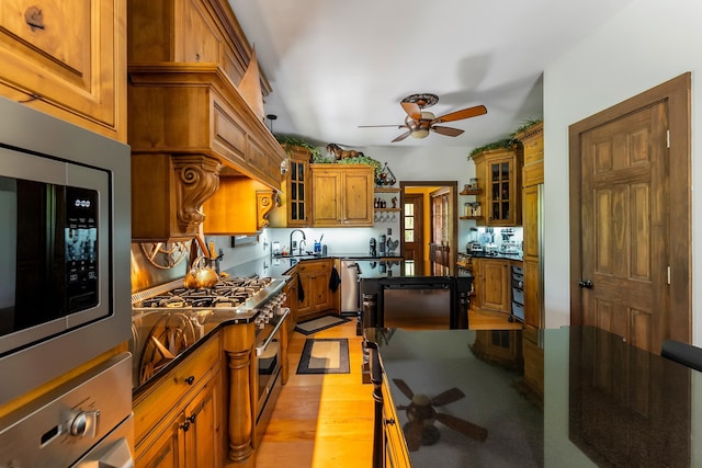 463 Rte 47 N, Goshen, NJ 08210 - kitchen featuring ceiling fan, appliances with stainless steel finishes, brown cabinets, light wood-type flooring, and glass insert cabinets