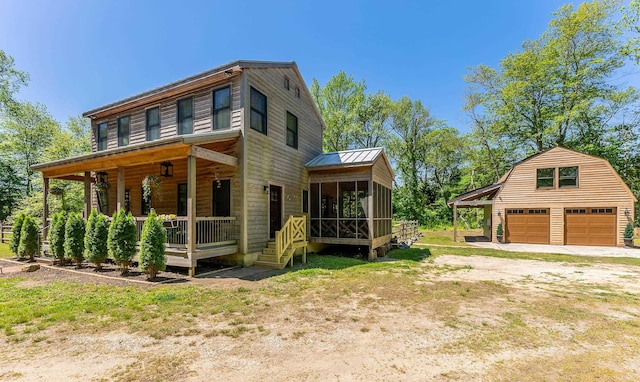 463 Rte 47 N, Goshen, NJ 08210 - view of front of house featuring a sunroom, a detached garage, an outdoor structure, and metal roof