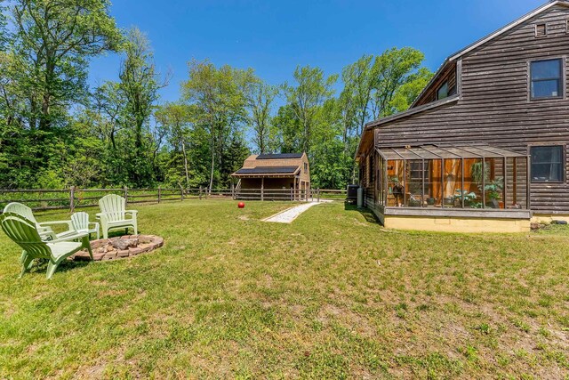 463 Rte 47 N, Goshen, NJ 08210 - view of yard featuring an outbuilding, a fire pit, and a sunroom