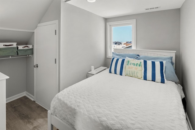 810 E 7th St Unit 4, Ocean City, NJ 08226 - bedroom with wood finished floors and lofted ceiling