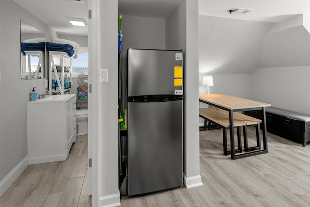 810 E 7th St Unit 4, Ocean City, NJ 08226 - kitchen with freestanding refrigerator, light wood finished floors, and lofted ceiling