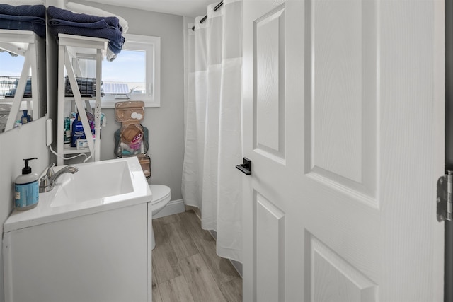 810 E 7th St Unit 4, Ocean City, NJ 08226 - full bath featuring healthy amount of natural light, wood finished floors, vanity, and a shower with curtain