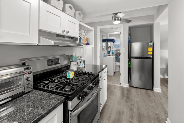 810 E 7th St Unit 4, Ocean City, NJ 08226 - kitchen with stainless steel appliances, under cabinet range hood, light wood finished floors, white cabinetry, and dark stone counters
