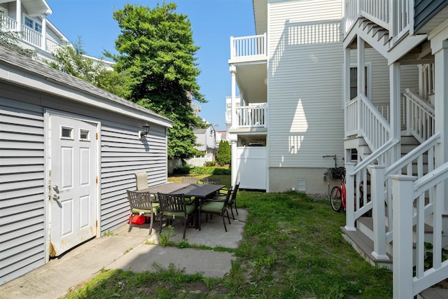 810 E 7th St Unit 4, Ocean City, NJ 08226 - view of grassy yard with a patio, stairway, and outdoor dining space