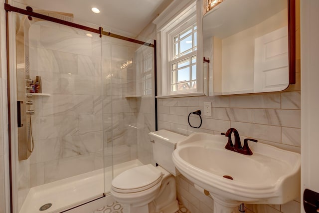 2901 Pacific Ave, Wildwood, NJ 08260 - full bathroom with a sink, tile walls, toilet, and a stall shower