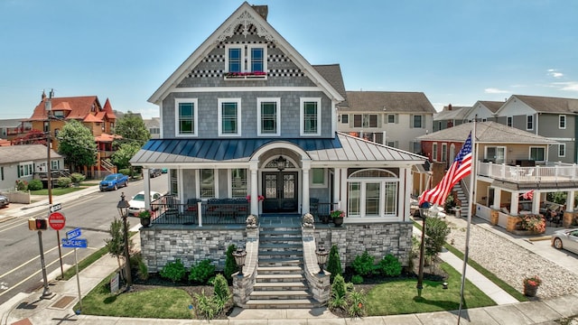 2901 Pacific Ave, Wildwood, NJ 08260 - victorian home featuring a standing seam roof, stairway, metal roof, french doors, and a porch