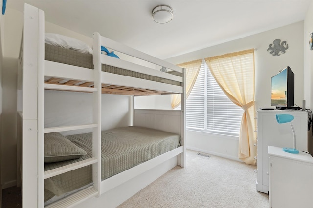 bedroom with light carpet