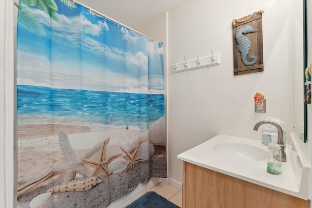 bathroom with tile patterned flooring and vanity