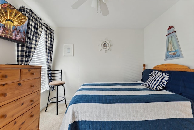 bedroom with light carpet and ceiling fan