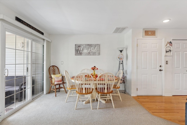 dining space featuring carpet floors