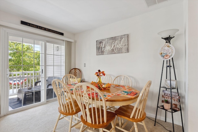 dining area featuring carpet