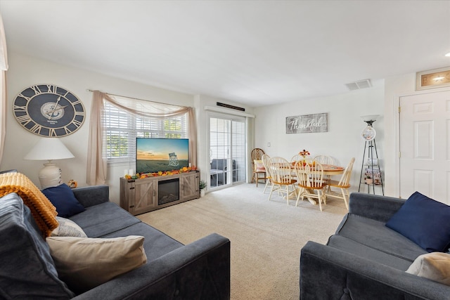 carpeted living room featuring a wealth of natural light