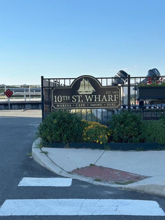 community sign with fence