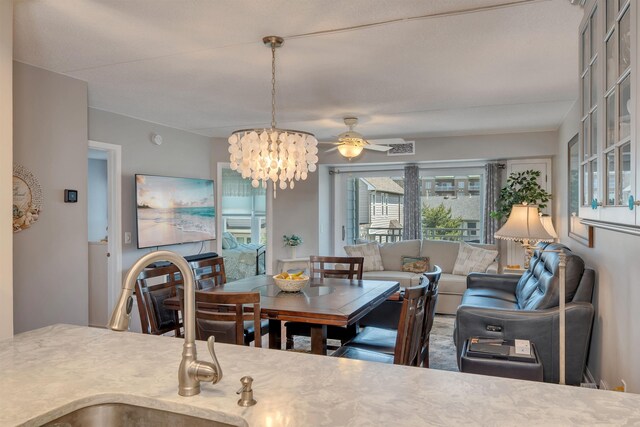 9907 Seapointe Blvd Unit 215, Lower Township, NJ 08260 - dining area with ceiling fan and a chandelier