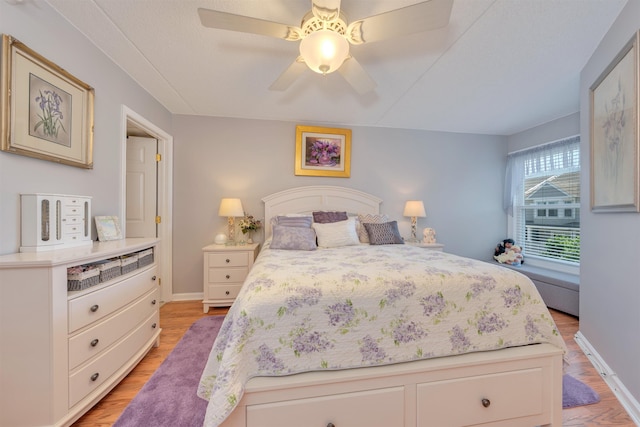9907 Seapointe Blvd Unit 215, Lower Township, NJ 08260 - bedroom with light wood-style flooring and a ceiling fan