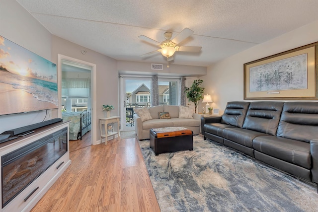 9907 Seapointe Blvd Unit 215, Lower Township, NJ 08260 - living area with a ceiling fan, light wood-type flooring, and a textured ceiling