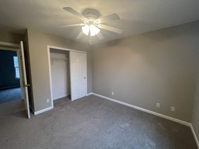 unfurnished bedroom featuring ceiling fan, a closet, and carpet