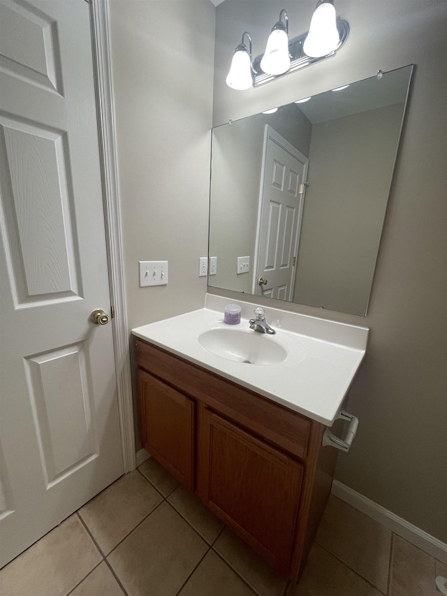 bathroom with tile patterned floors and vanity