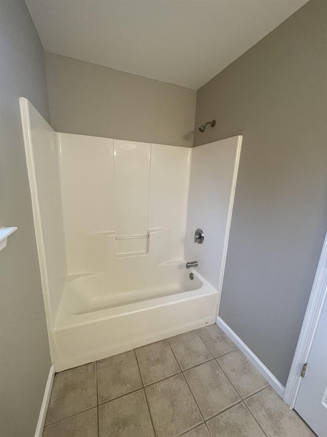 bathroom featuring tile patterned flooring and bathtub / shower combination