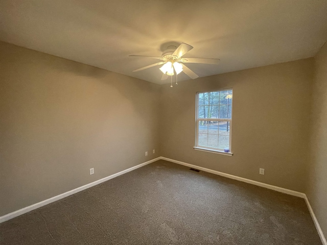 spare room with carpet and ceiling fan