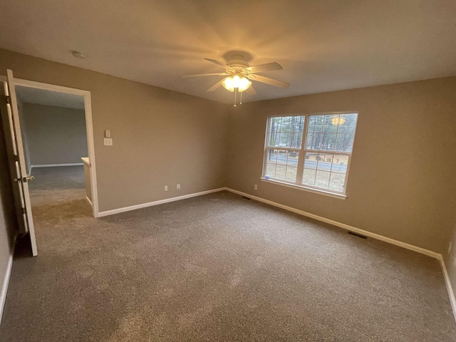 carpeted empty room with ceiling fan