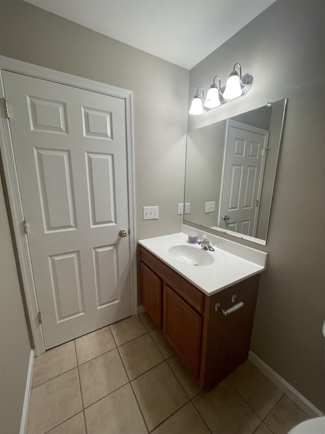 bathroom with tile patterned flooring and vanity