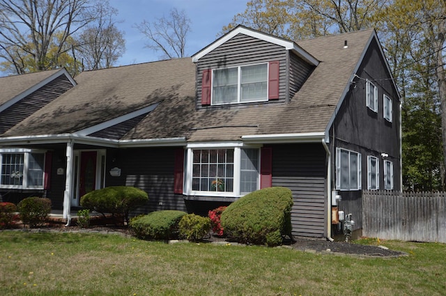 10 Timberlea Ln, Cape May Court House, NJ 08210 - view of front of home with fence, a front yard, and a shingled roof