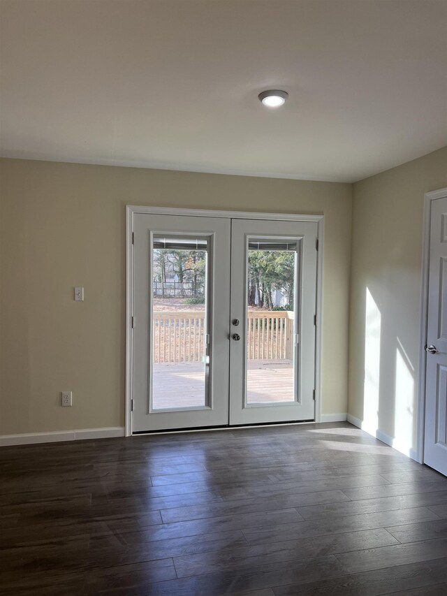 unfurnished living room with dark wood-type flooring and ceiling fan