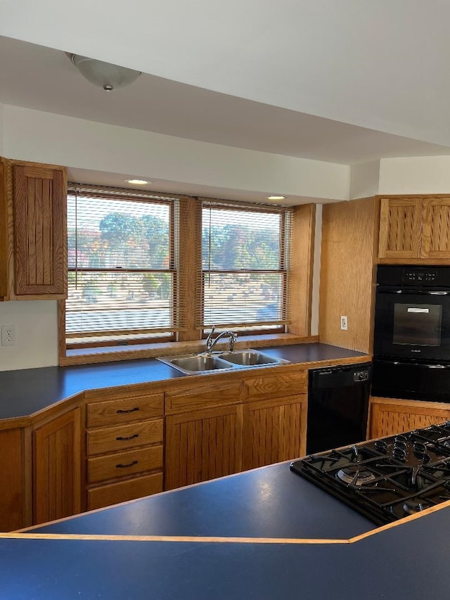 kitchen featuring sink and black appliances