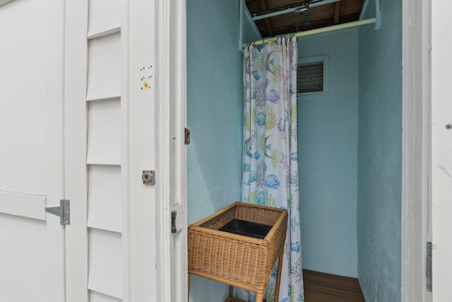 148 E Burk Ave Unit 3, Wildwood, NJ 08260 - bathroom with wood finished floors and a textured wall
