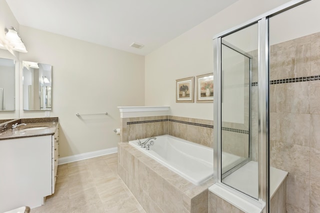 7 Herron Ct Unit 40, Cape May Court House, NJ 08210 - bathroom featuring vanity, a bath, a stall shower, tile patterned flooring, and baseboards